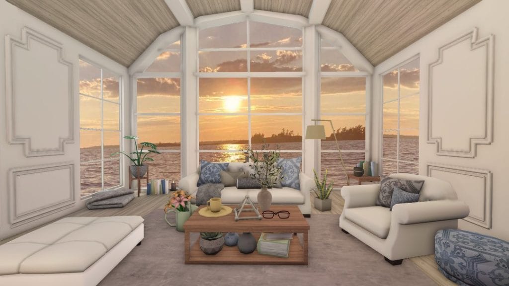 A summer vacation home living room with light furniture, coastal colors, and a view of the outdoors.