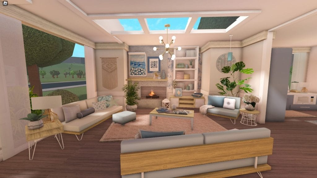 Modern coastal beach home living room with ocean views and light-colored furniture.