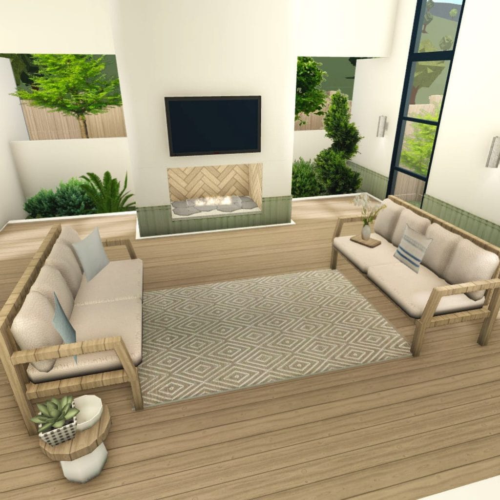 Coastal apartment living room with natural light and beachy decor.