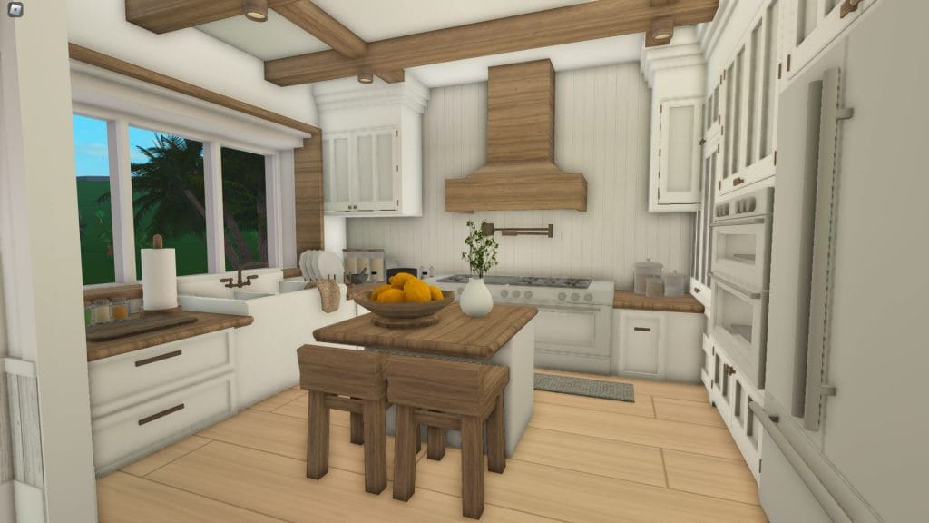 A coastal-inspired kitchen with light wood and white accents, featuring a large window and a small island with wooden stools.