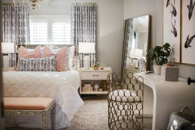 Glamorous room with metallic accents, geometric patterns, and a stylish vanity.