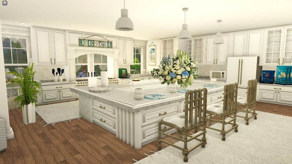 A bright Bloxburg kitchen with white cabinetry, coastal decor, and a large island.