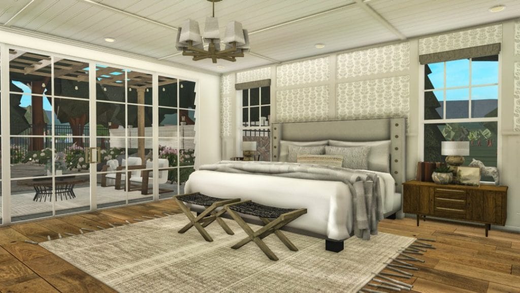 A luxurious bedroom in a Nantucket beach mansion with classic coastal decor and elegant furnishings.