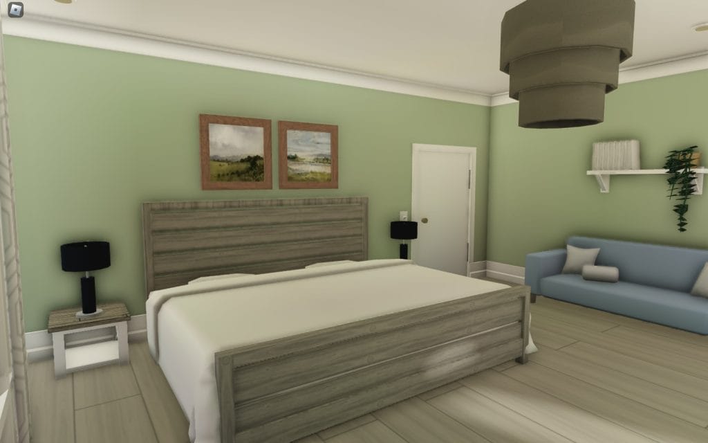 A minimalist bedroom with a green accent wall and wooden furniture, creating a cozy atmosphere.