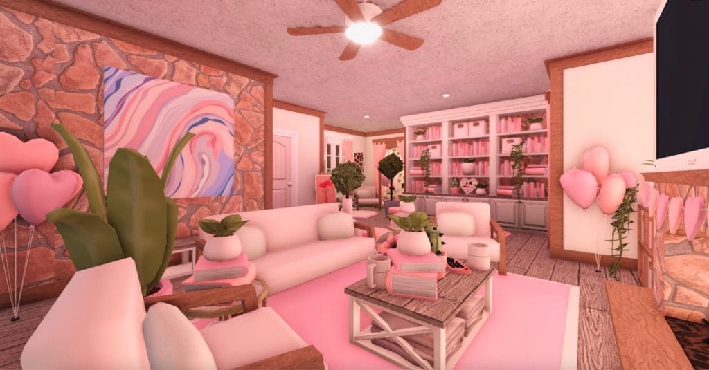 A Valentine-themed living room with soft pink hues, heart-shaped decorations, and cozy seating.