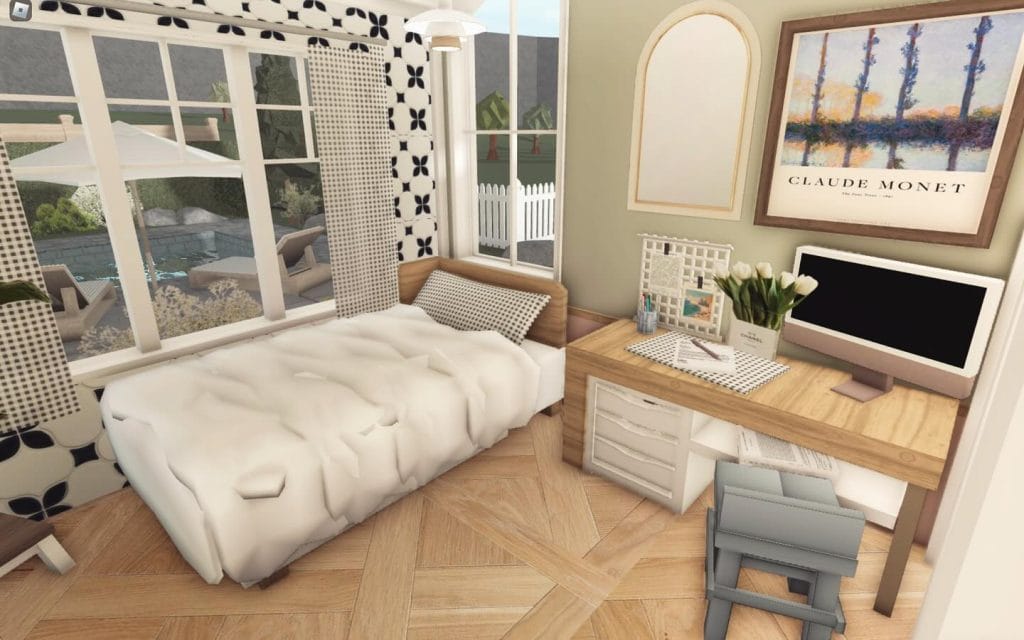 Elegant bedroom with light wood furniture and soft green accents.