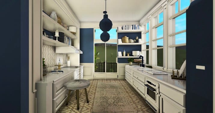 Parisian-inspired kitchen with blue cabinets, open shelving, and white countertops.