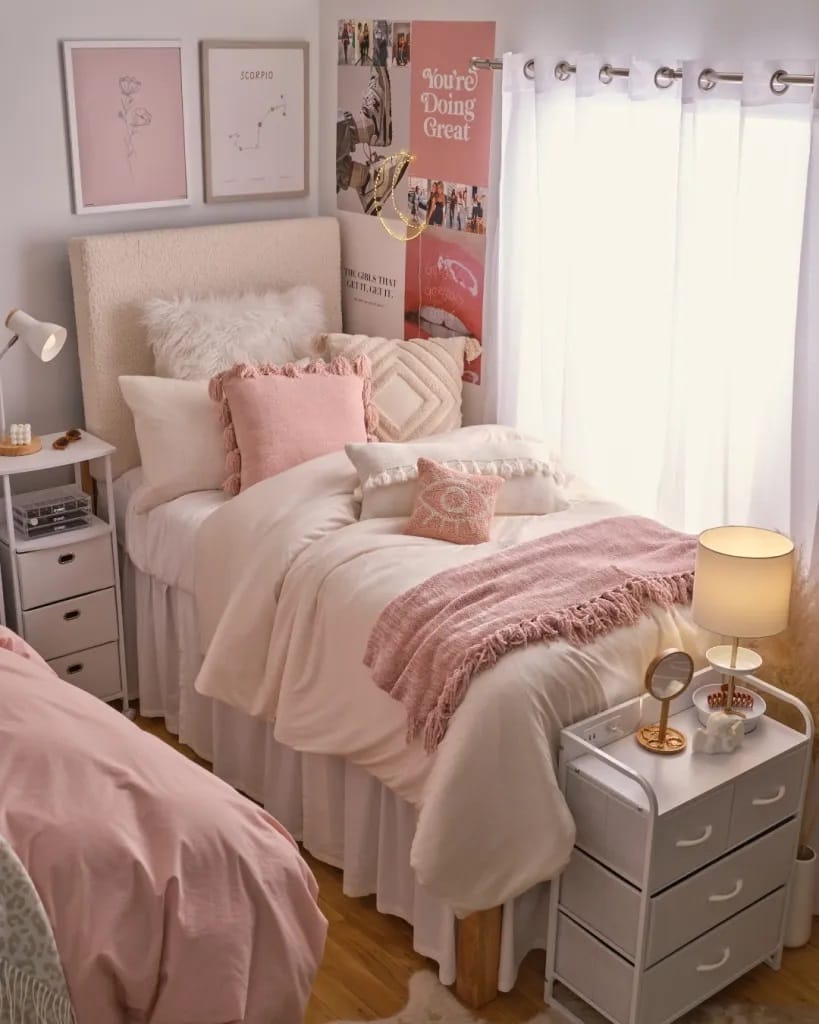 Blush-themed dorm room with plush pillows and cozy blankets.