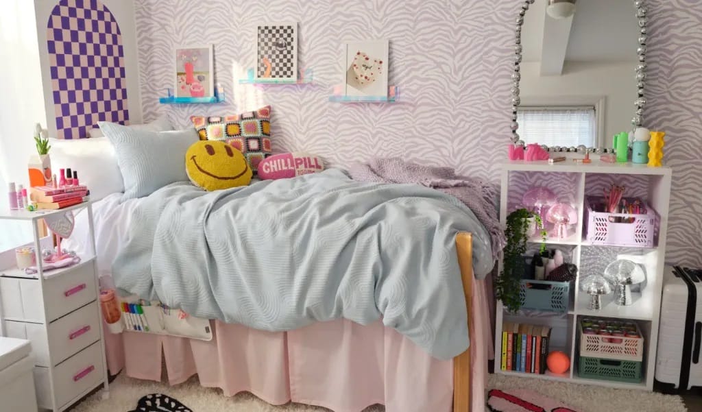 A colorful and playful bedroom with zebra-print wallpaper and a smiley face pillow.