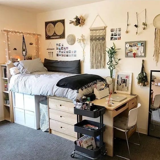 A bohemian bedroom with macrame wall hangings, fairy lights, and wooden accents.