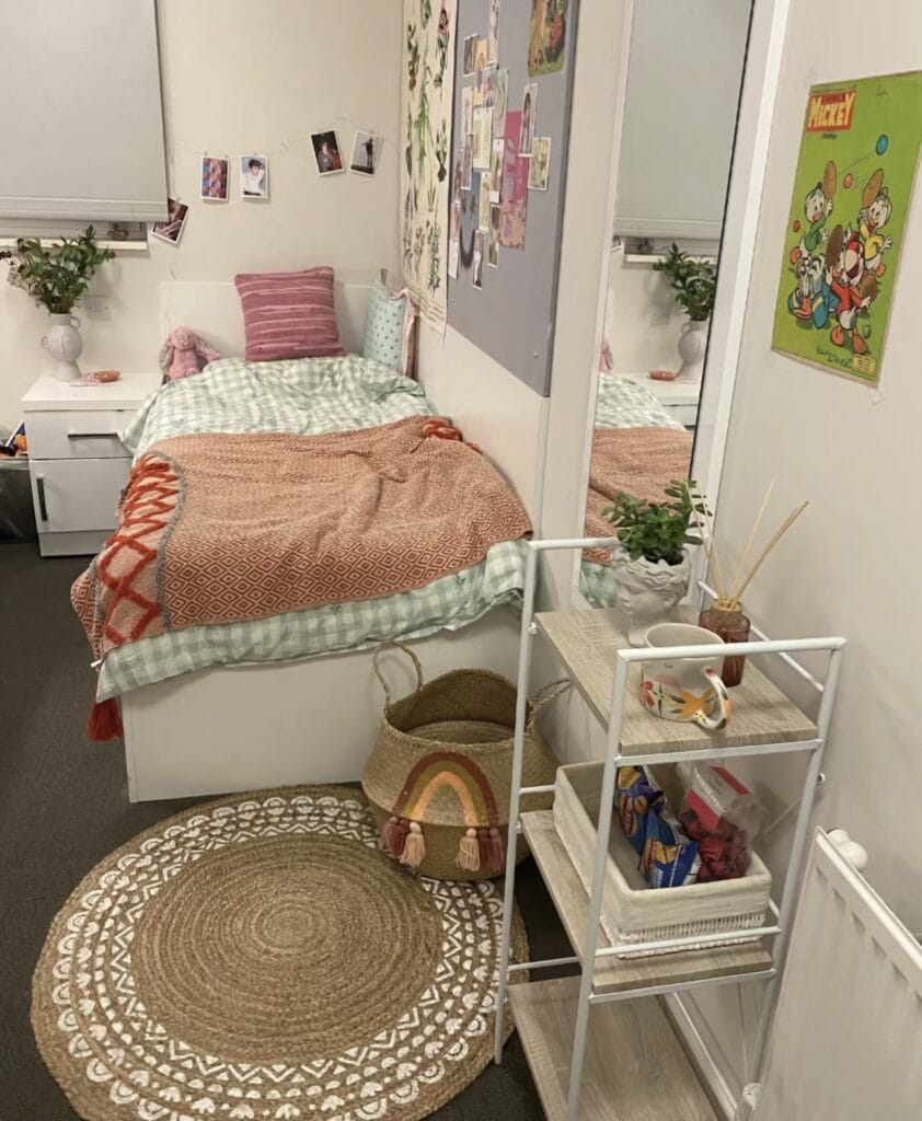 A dorm room with colorful accents, playful decor, and cozy textiles creating a charming and inviting atmosphere.