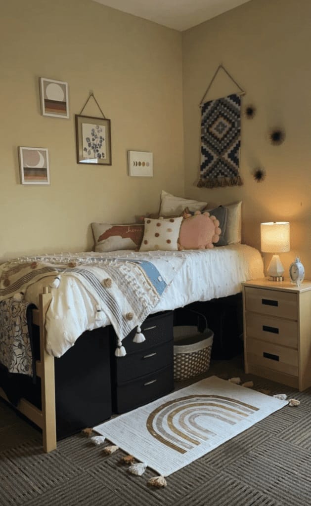 A dorm room with earthy tones, soft textiles, and boho decor creating an inviting and relaxing atmosphere.