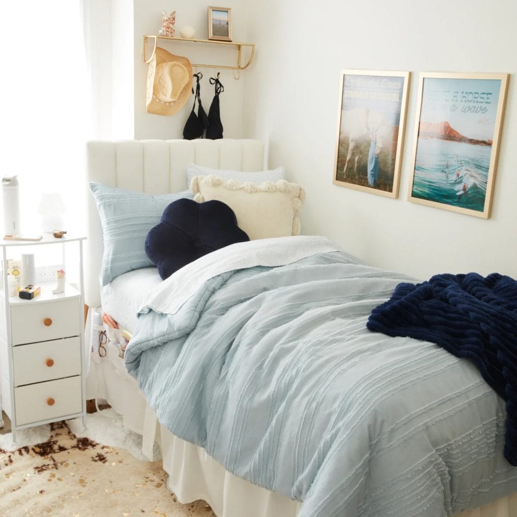 Room with a plush bed, ambient lighting, and decorative pillows.