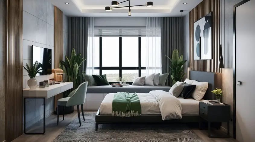 A teen boy’s room with modern decor, neutral colors, and green plants creating a fresh and sleek environment.