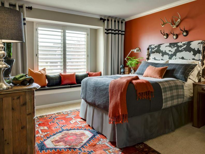 Teen boy's room with warm earth tones, rustic decor, and orange accents.