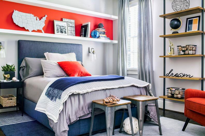 Teen boy's room with modern Americana decor, red, white, and blue accents, and wall shelves.