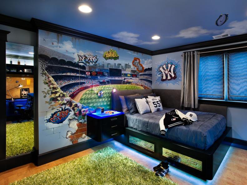 A teen boy's bedroom with a baseball stadium mural, dark furniture, and sports-themed decor.