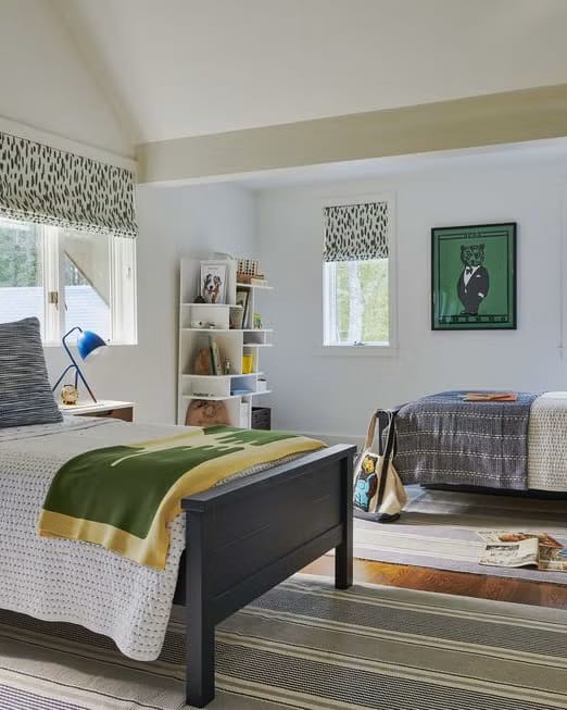 Shared teen boy's bedroom with twin beds, neutral decor, and patterned window treatments.