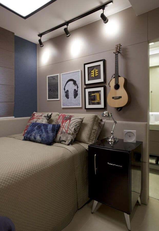 A music-themed room with wall-mounted guitars, music-themed decor, and a cozy bed with soft lighting.