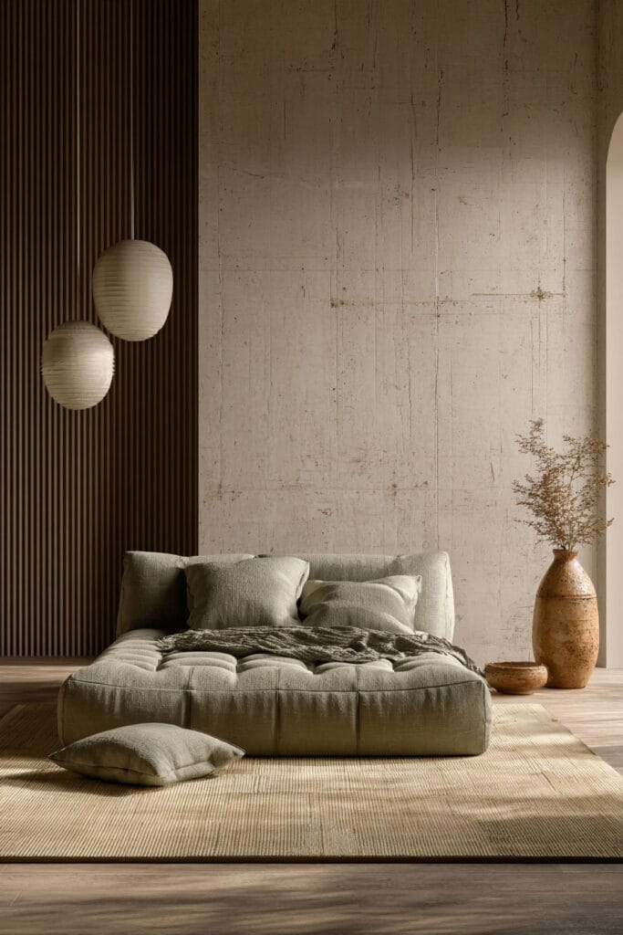 Minimalist bedroom with sage green platform bed, arched windows, pendant lights, and neutral decor.